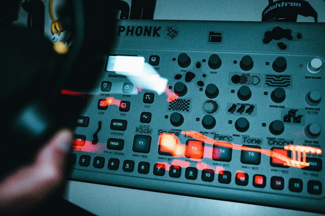 Close up of hands operating a video switcher panel with camera preview buttons