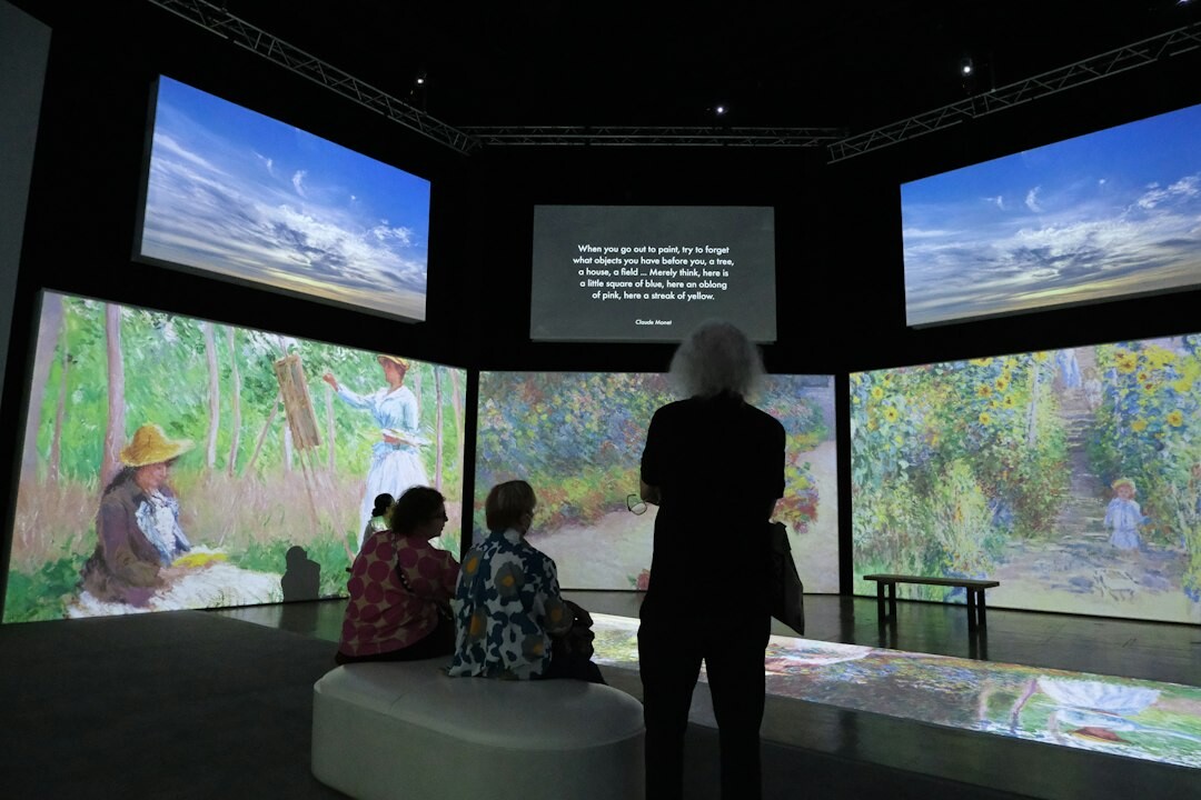 Technical director watching a wall of multiviewer screens in a broadcast gallery